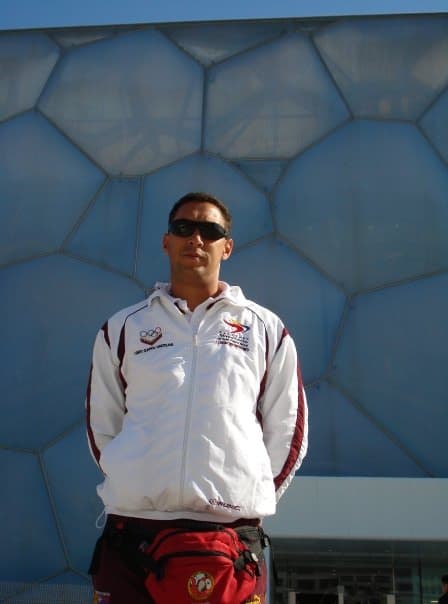 Coach Ilich Marcano in a white Venezuela team jacket at the 2008 Beijing Olympics